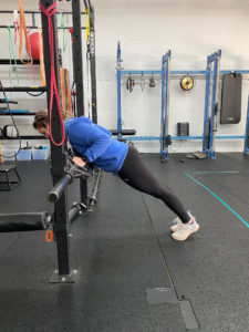 The bottom position of the hands elevated push up - reduced load into the hands from the incline and still maintaining a strong plank position.